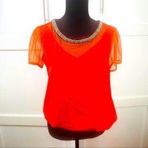 orange red blouse with jewels details